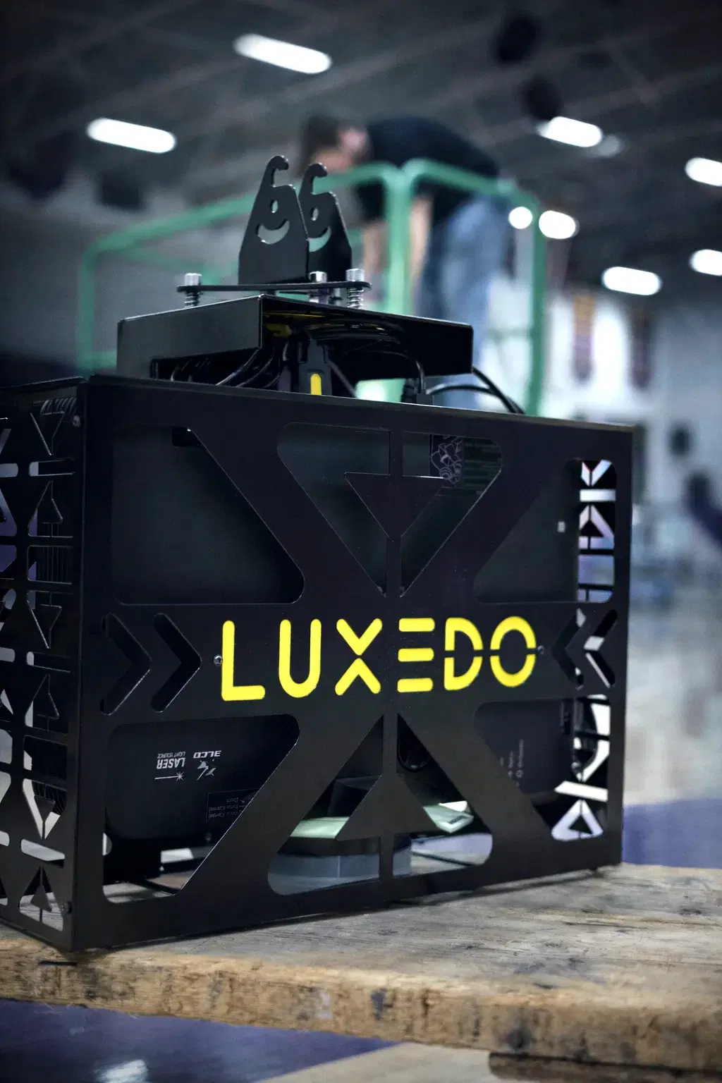 Close-up of the Luxedo high-brightness projector used for basketball court light shows